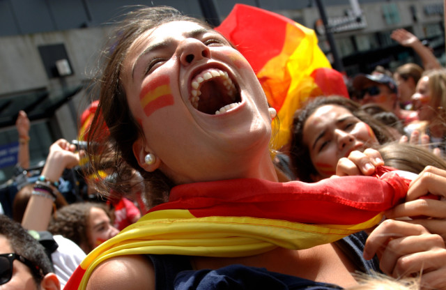 Spain sports fan with flag Sergei Bachlakov shutterstock_56968105