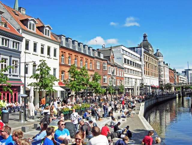 L2F Mar 17 pic Denmark Aarhus crowds along canal shutterstock_449363242