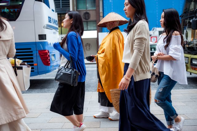 L2F May 17 pic Japan Palka Buddhist monk amid walking girls