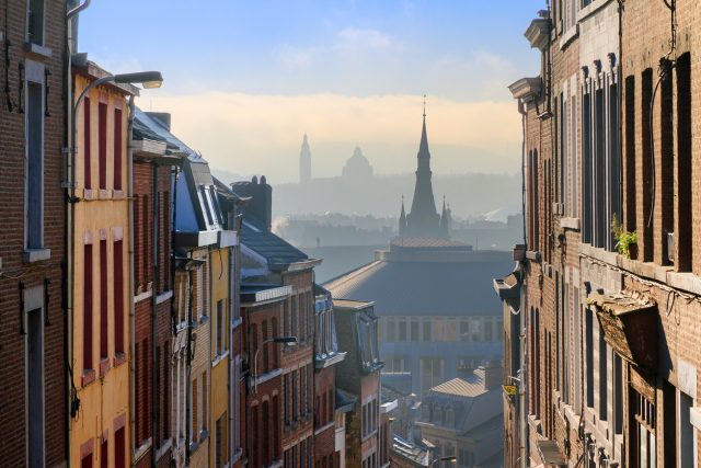 Beautiful urban cityscape see through with a view over Liege, Belgium, from one of the street leading up the hill on a sunny winter morning