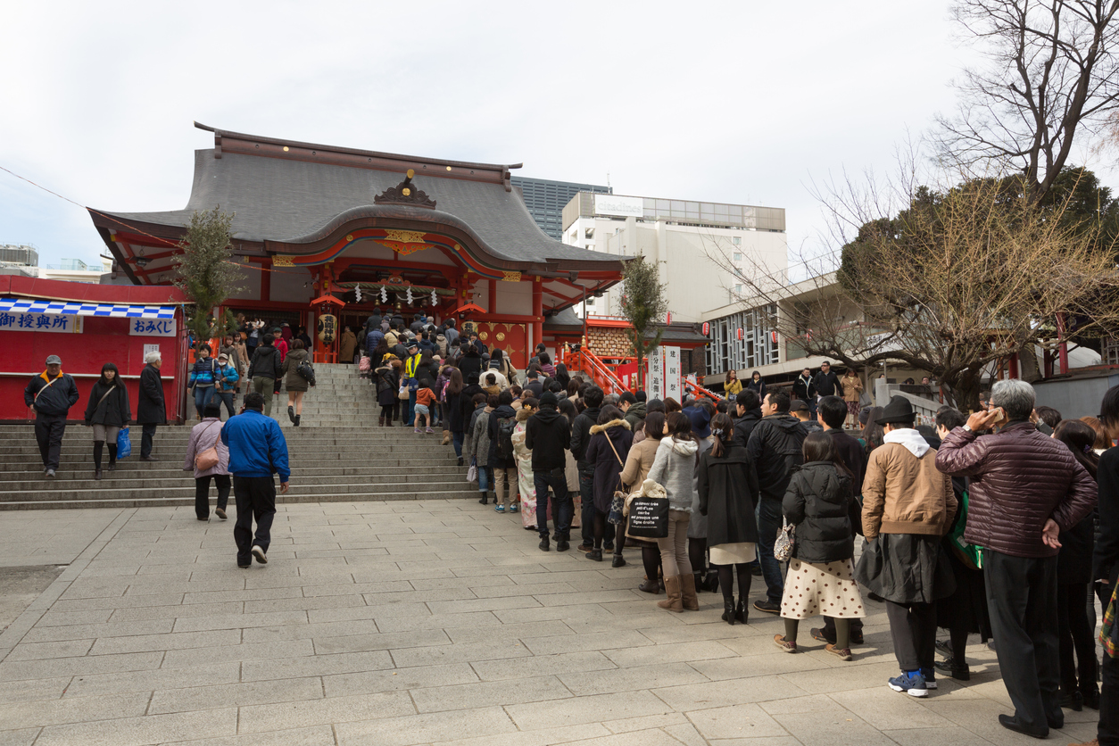 Tokyo, Japan - January 2, 2016 : People at Hanazono Shrine in Shinjuku, Tokyo, Japan. Japanese go to Shrine to ask for health, wealth and divine protection during the New year.