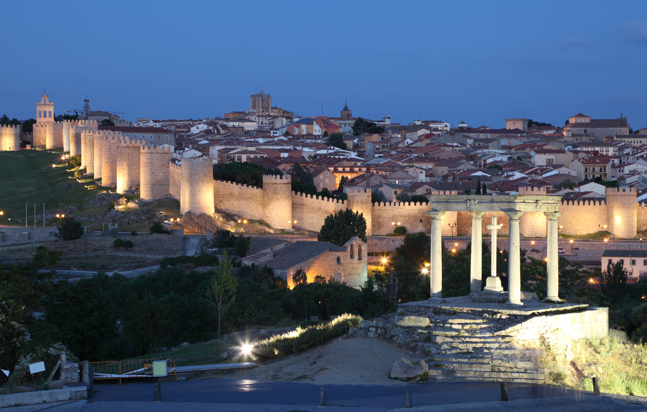 Medieval city of Avila illuminated at dusk. Castile and Leon, Spain